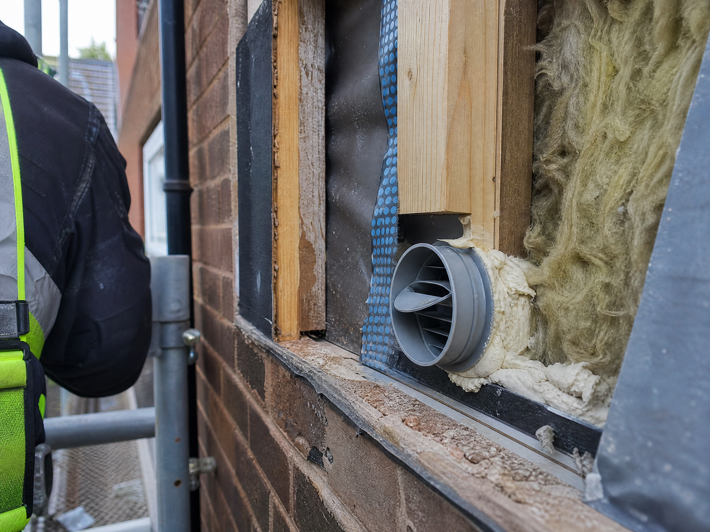 Close-up detail of materials and technique used in condensation control and ventilation — showing quality
