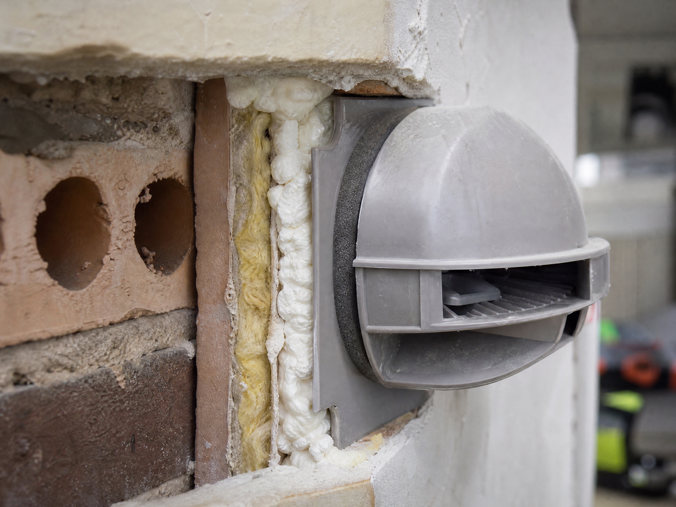Close-up detail of materials and technique used in positive input ventilation (piv) installation — showing quality